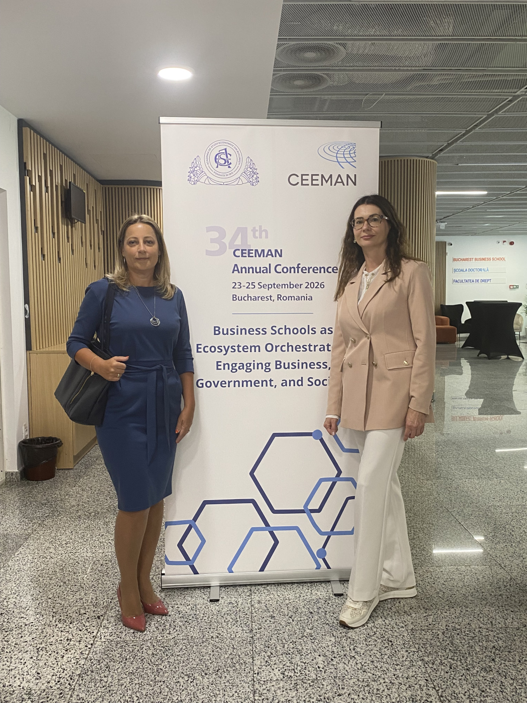 women during a poster session